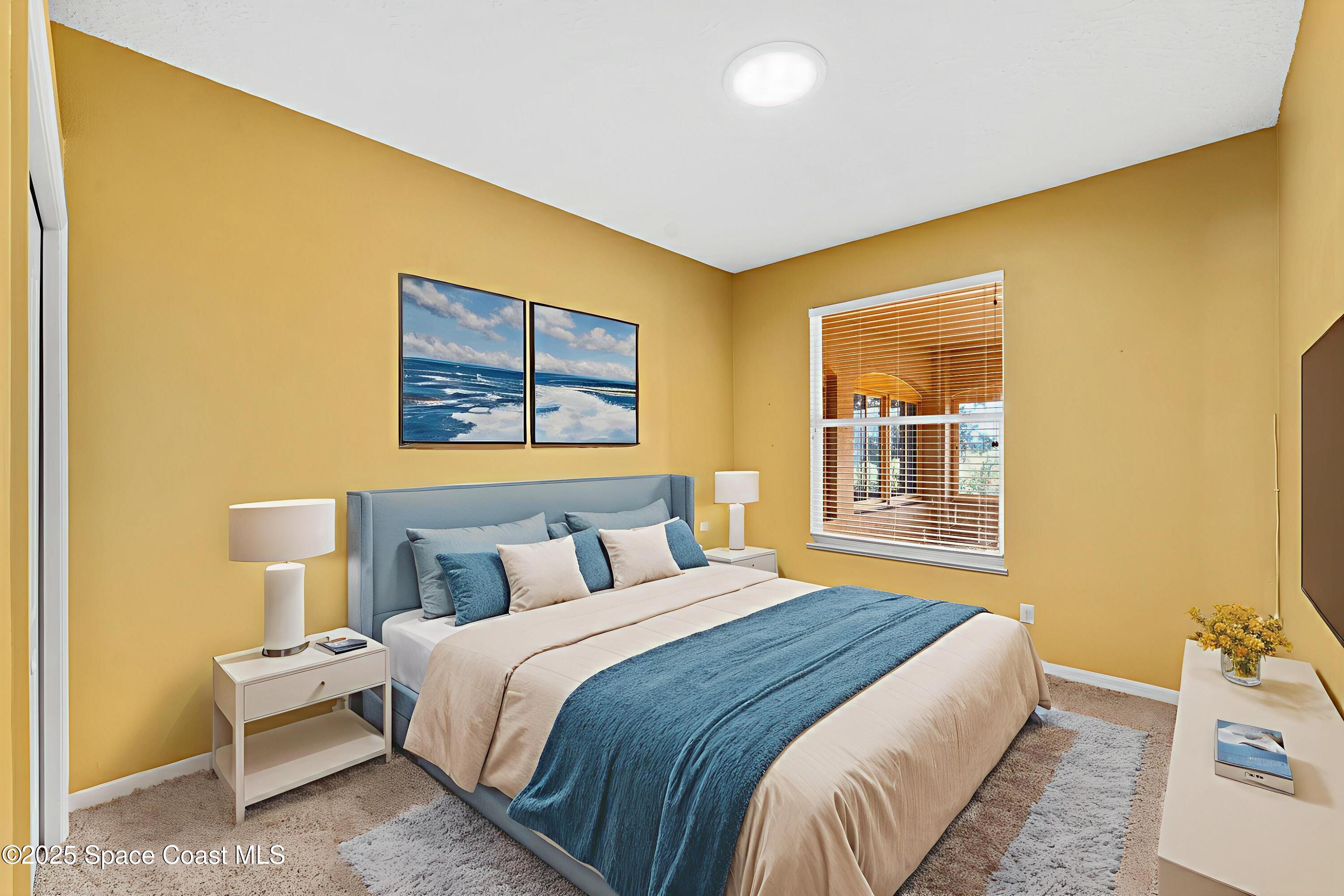 4221 Aberdeen Circle Rockledge, FL 32955 - Photo 23 of 45 a bedroom with a bed and a painting on the wall