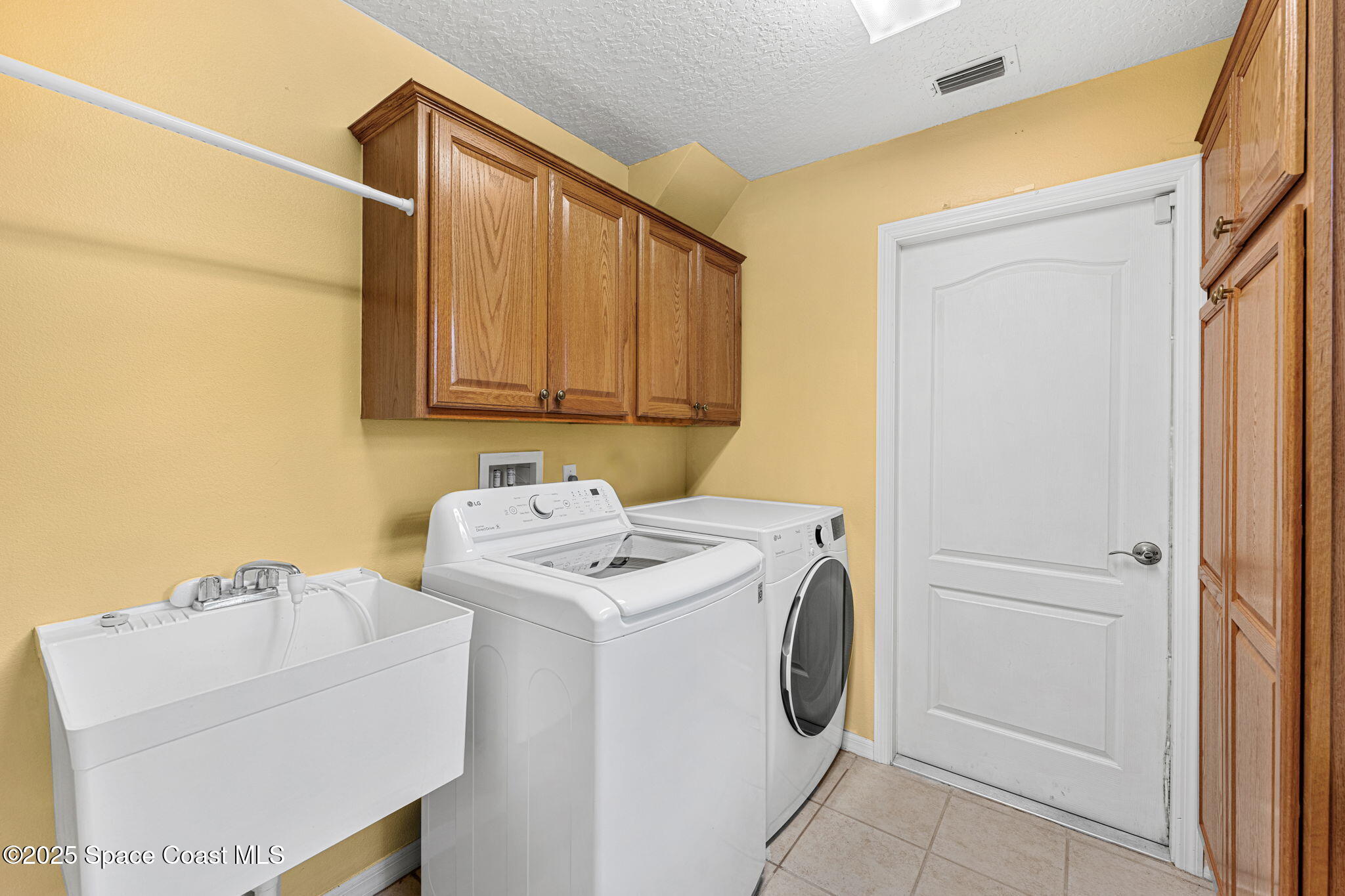 4221 Aberdeen Circle Rockledge, FL 32955 - Photo 25 of 45 a utility room with dryer and washer