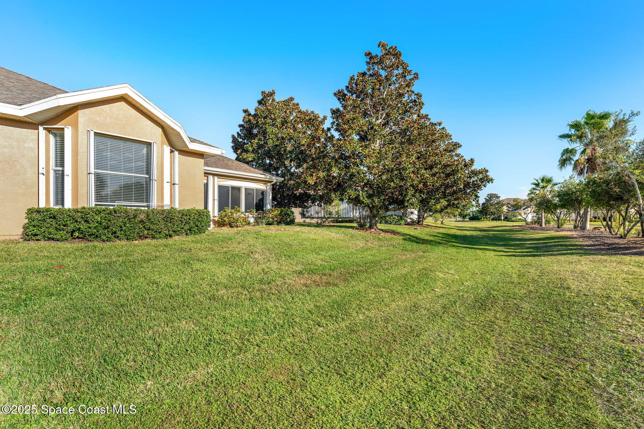 4221 Aberdeen Circle Rockledge, FL 32955 - Photo 31 of 45 a front view of a house with a yard