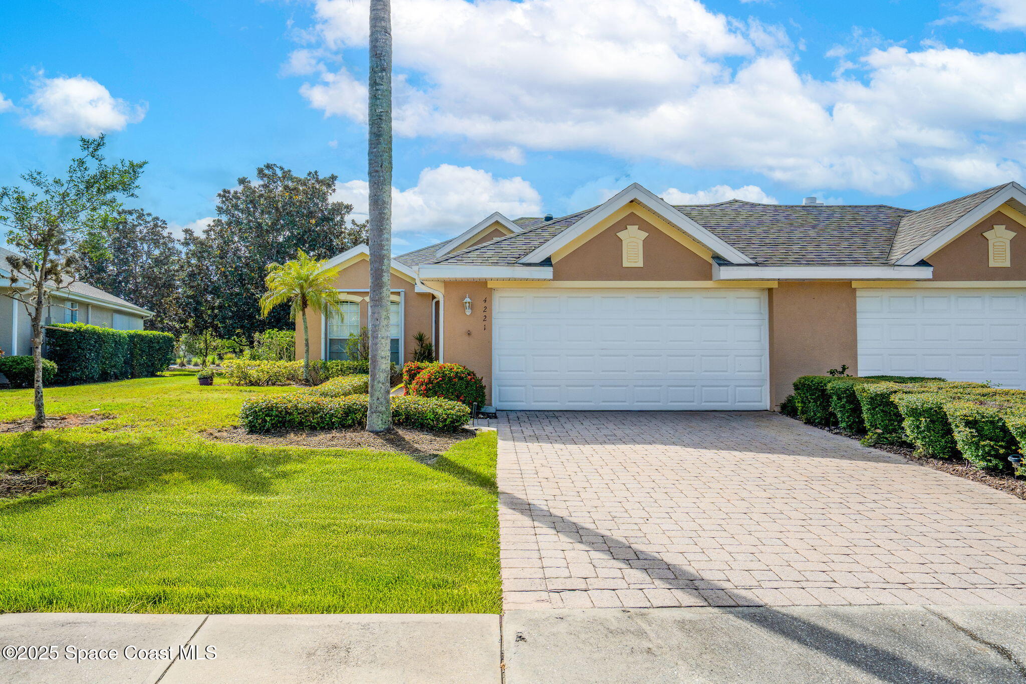 4221 Aberdeen Circle Rockledge, FL 32955 - Photo 36 of 45 a front view of a house with garden