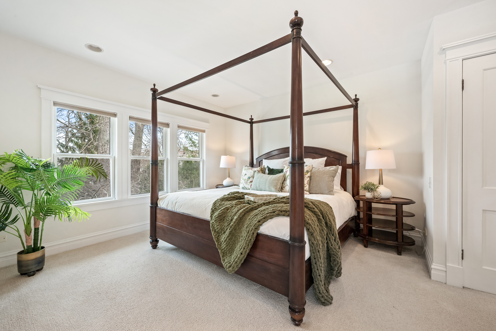 841 Prospect Avenue Winnetka, IL 60093 - Photo 16 of 35 a bedroom with a bed and a potted plant