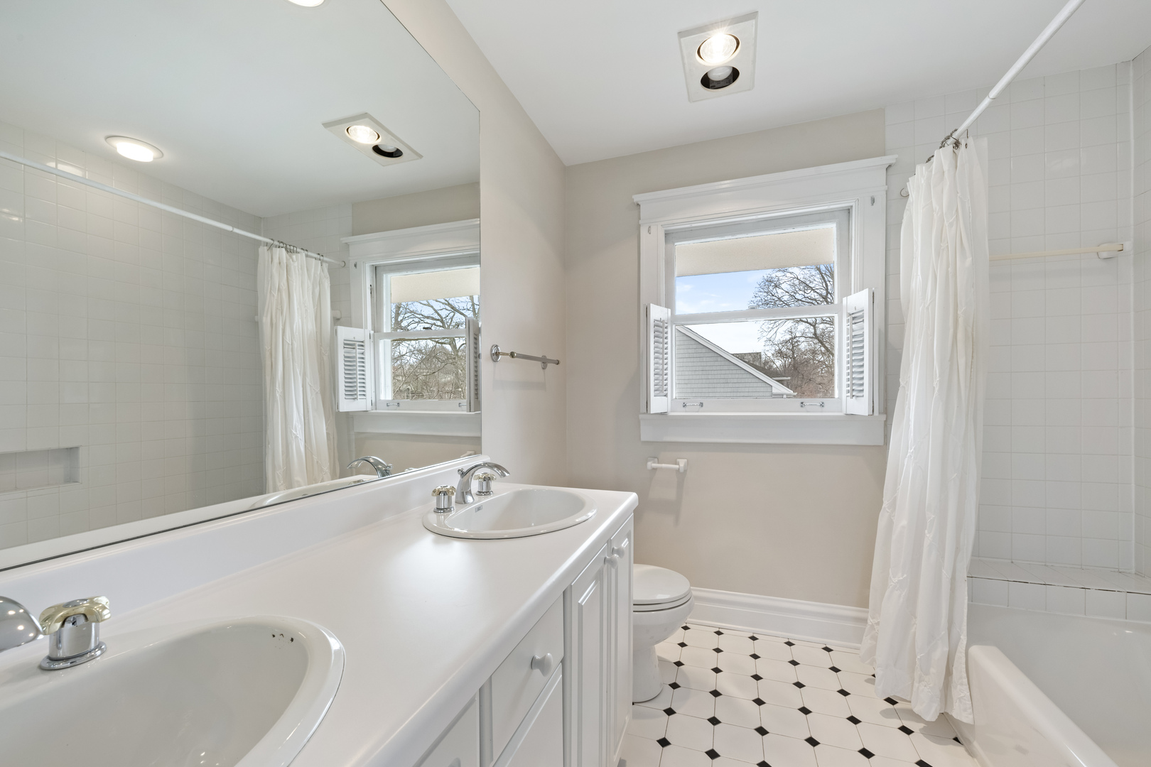 841 Prospect Avenue Winnetka, IL 60093 - Photo 23 of 35 a bathroom with a sink a toilet and a window