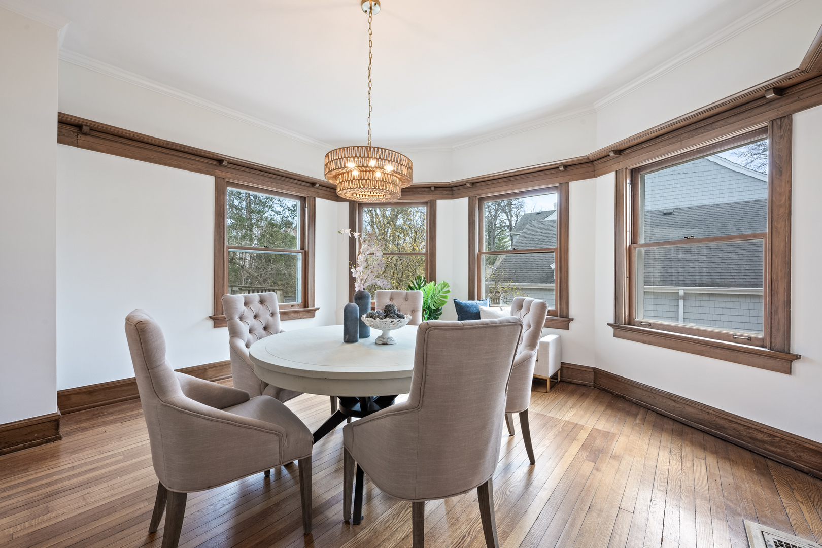841 Prospect Avenue Winnetka, IL 60093 - Photo 8 of 35 a view of a dining room with furniture large windows and wooden floor