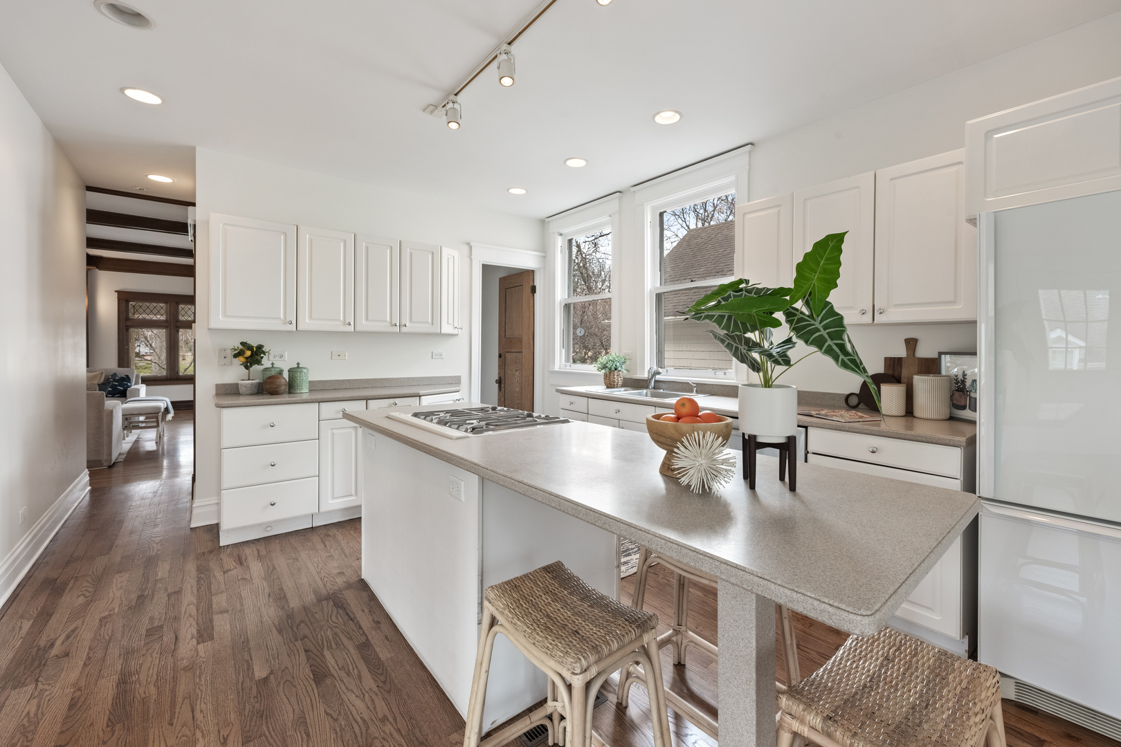 841 Prospect Avenue Winnetka, IL 60093 - Photo 10 of 35 a kitchen with white cabinets and stainless steel appliances