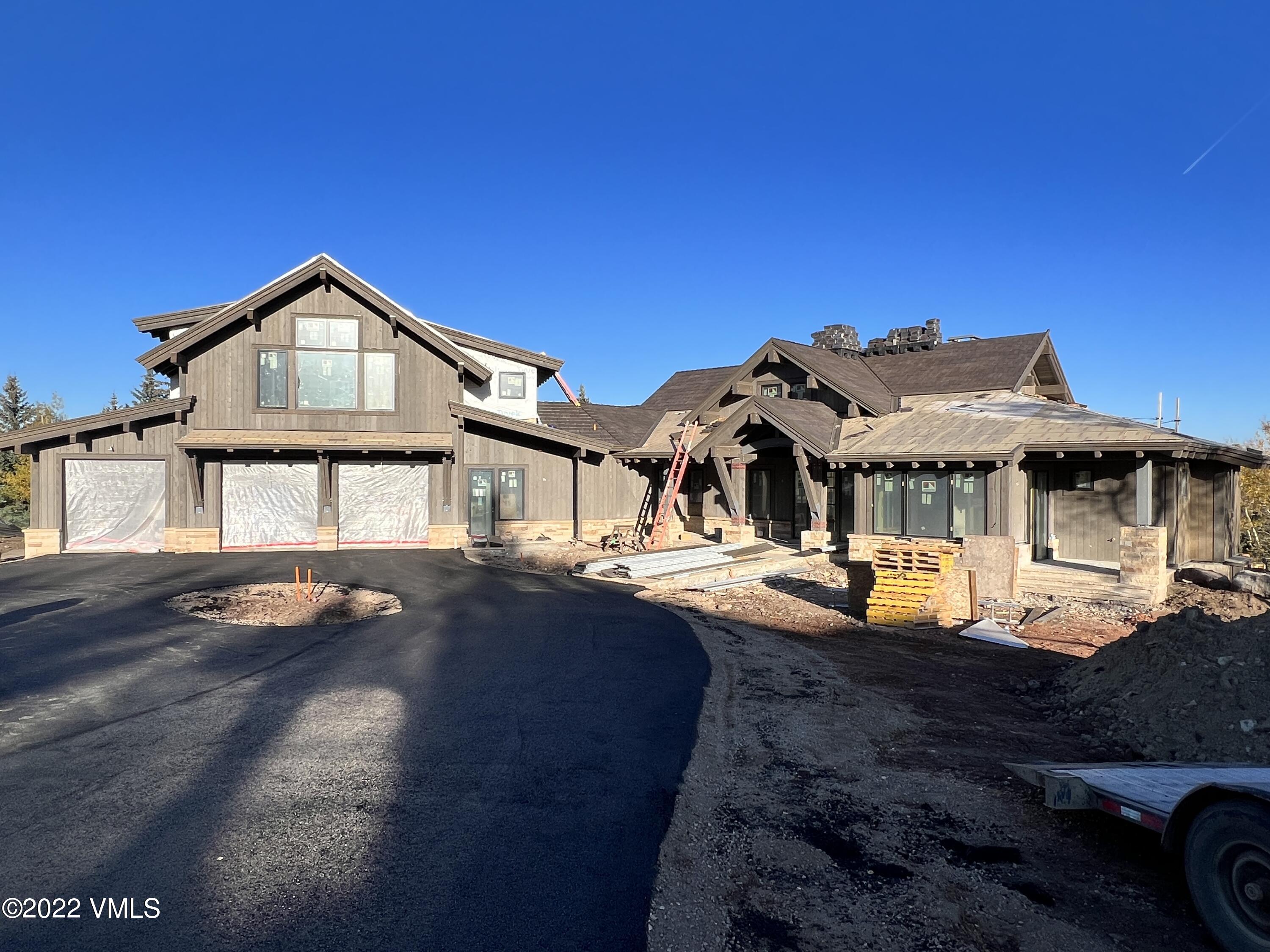 29 Kimberwick Way Edwards, CO 81632 - Photo 2 of 46 a front view of a house with yard and seating area