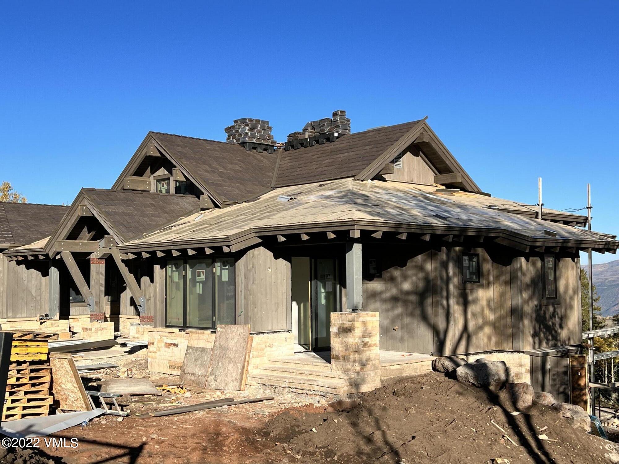 29 Kimberwick Way Edwards, CO 81632 - Photo 4 of 46 a view of a house with wooden deck and furniture