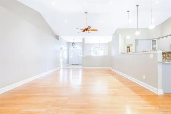 a view of a kitchen with a sink and a window