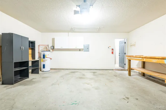 a view of a kitchen with furniture and a ceiling fan