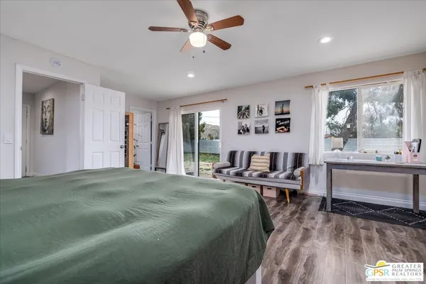 a bed room with a bed and a window