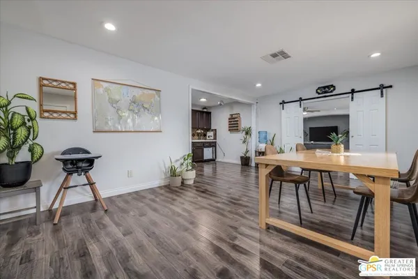 a view of a dining room with furniture window and wooden floor