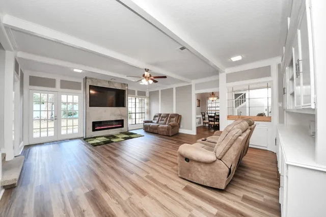 a living room with furniture and a flat screen tv