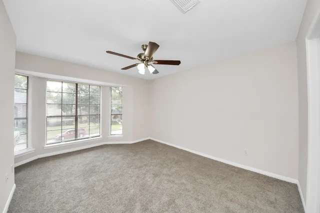 an empty room with a large window