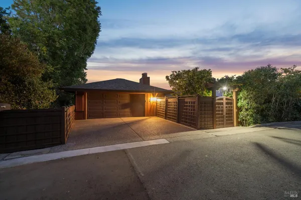 a view of a house with a yard and garage