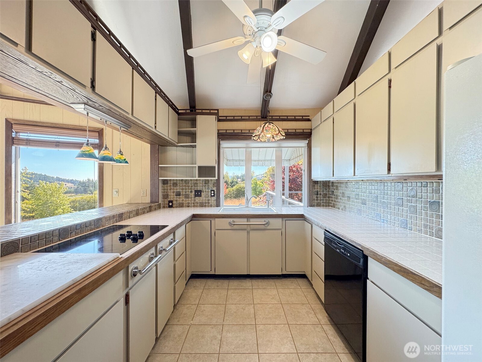63 Hummingbird Lane Sequim, WA 98382 - Photo 14 of 40 a kitchen with stainless steel appliances granite countertop a sink and cabinets