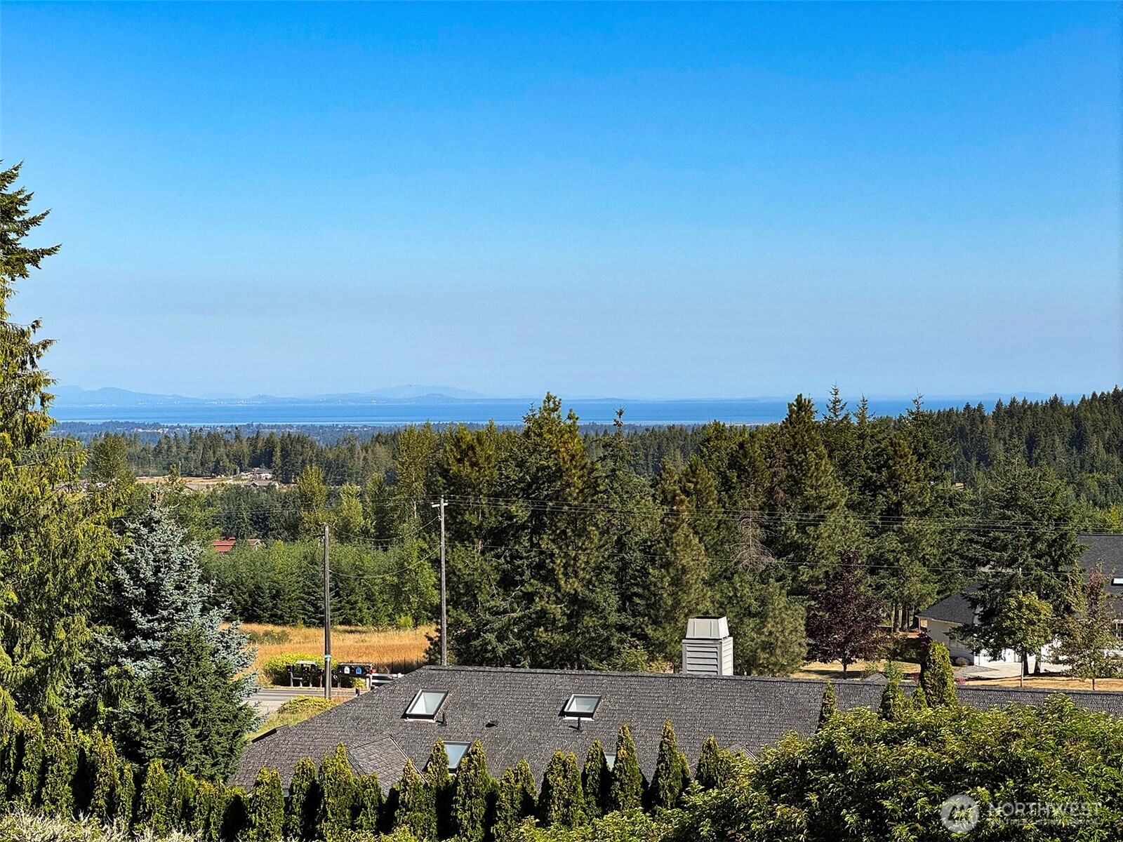 63 Hummingbird Lane Sequim, WA 98382 - Photo 19 of 40 a view of a city with sunset view