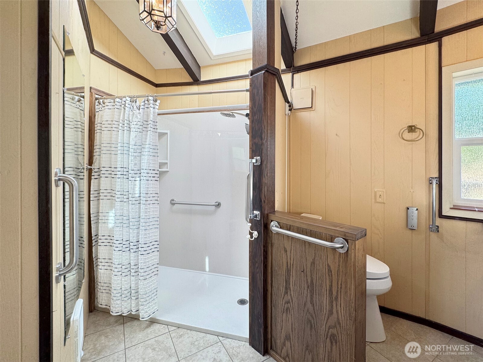 63 Hummingbird Lane Sequim, WA 98382 - Photo 20 of 40 a bathroom with a glass door shower