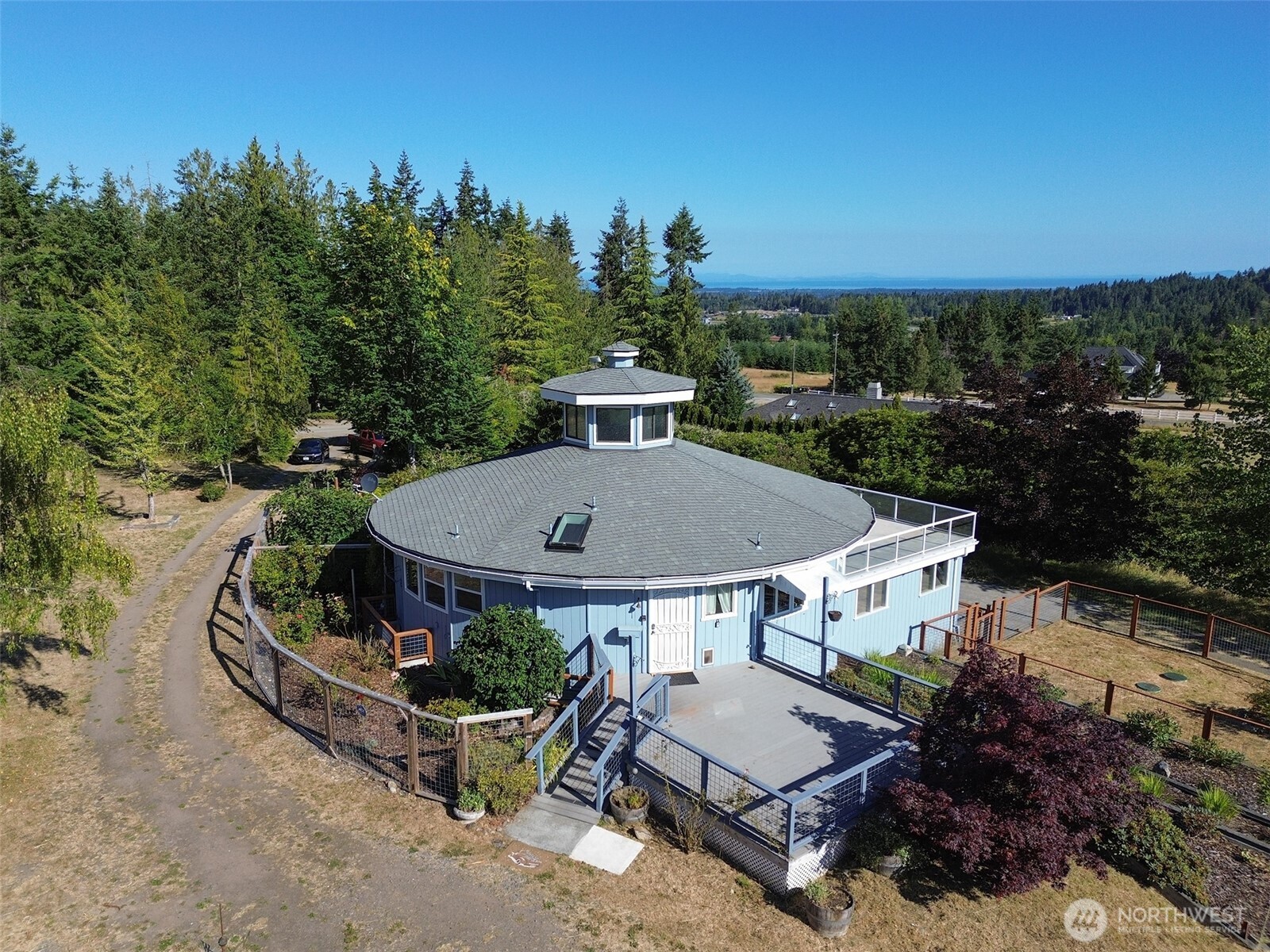 63 Hummingbird Lane Sequim, WA 98382 - Photo 2 of 40 an aerial view of a house and outdoor space