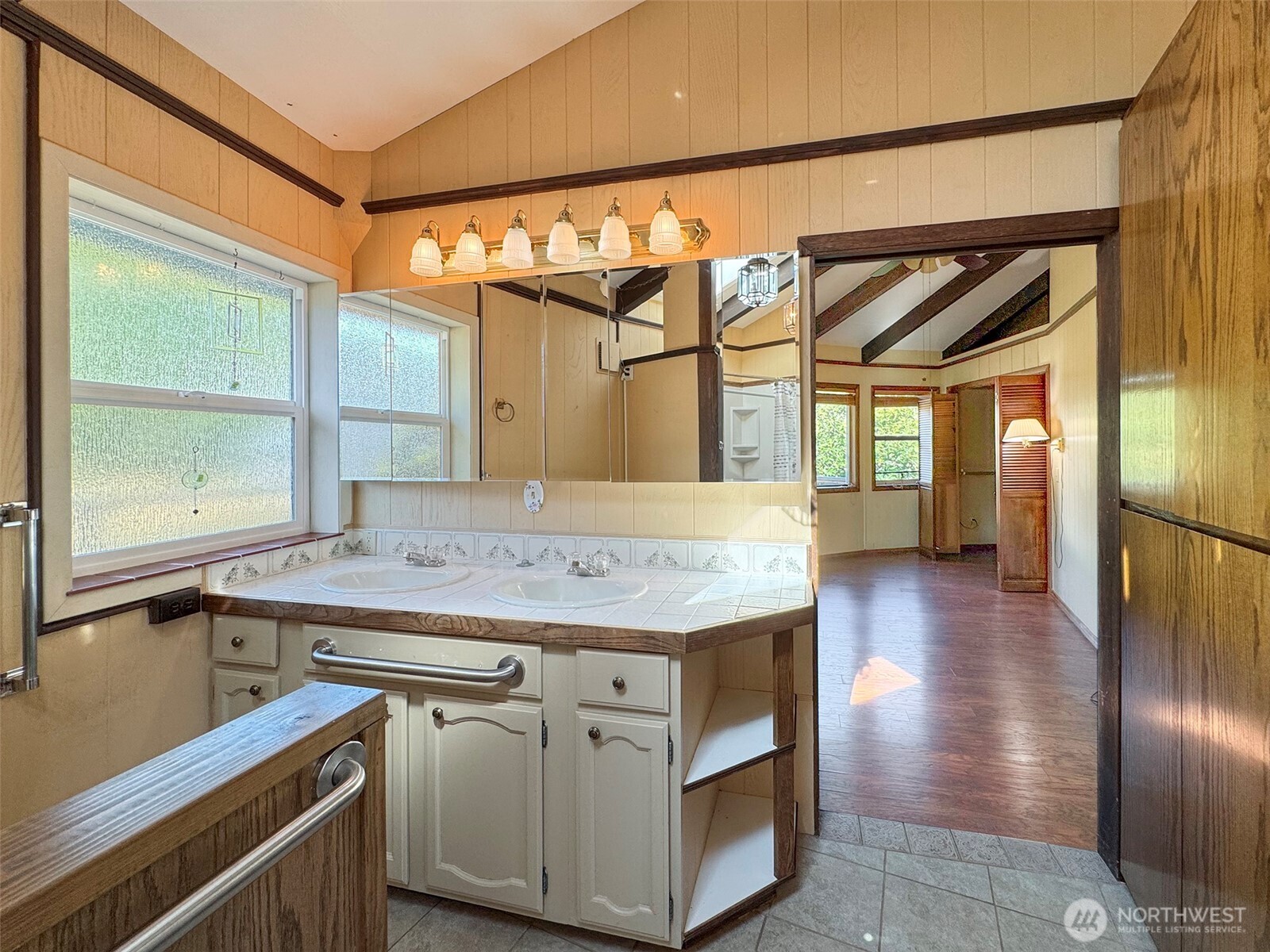 63 Hummingbird Lane Sequim, WA 98382 - Photo 21 of 40 a kitchen with a stove and a sink