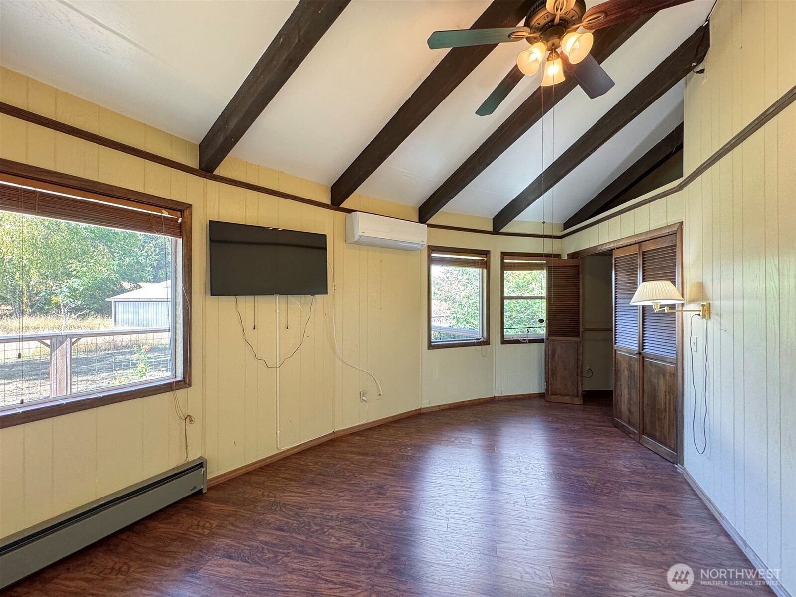 63 Hummingbird Lane Sequim, WA 98382 - Photo 22 of 40 a view of empty room with wooden floor and fan