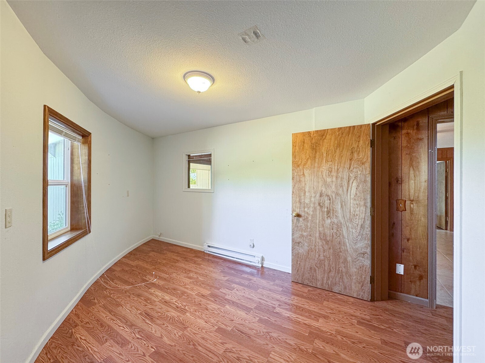 63 Hummingbird Lane Sequim, WA 98382 - Photo 27 of 40 an empty room with windows and closet