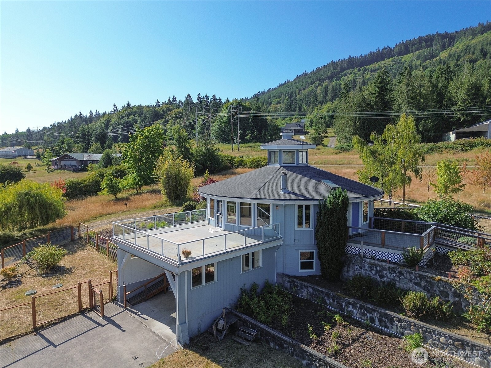 63 Hummingbird Lane Sequim, WA 98382 - Photo 3 of 40 an aerial view of a house with a garden