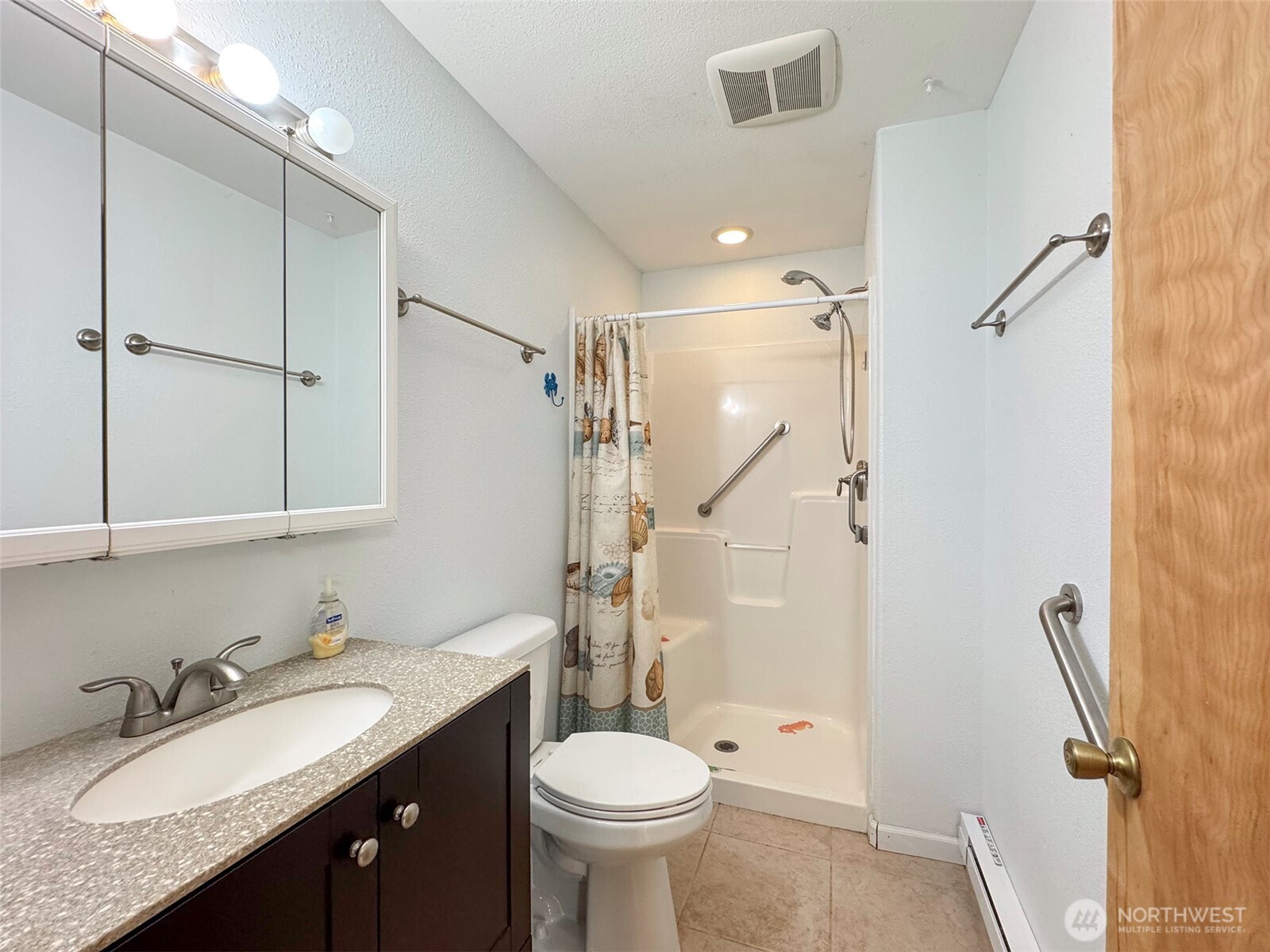 63 Hummingbird Lane Sequim, WA 98382 - Photo 31 of 40 a bathroom with a granite countertop sink toilet and shower