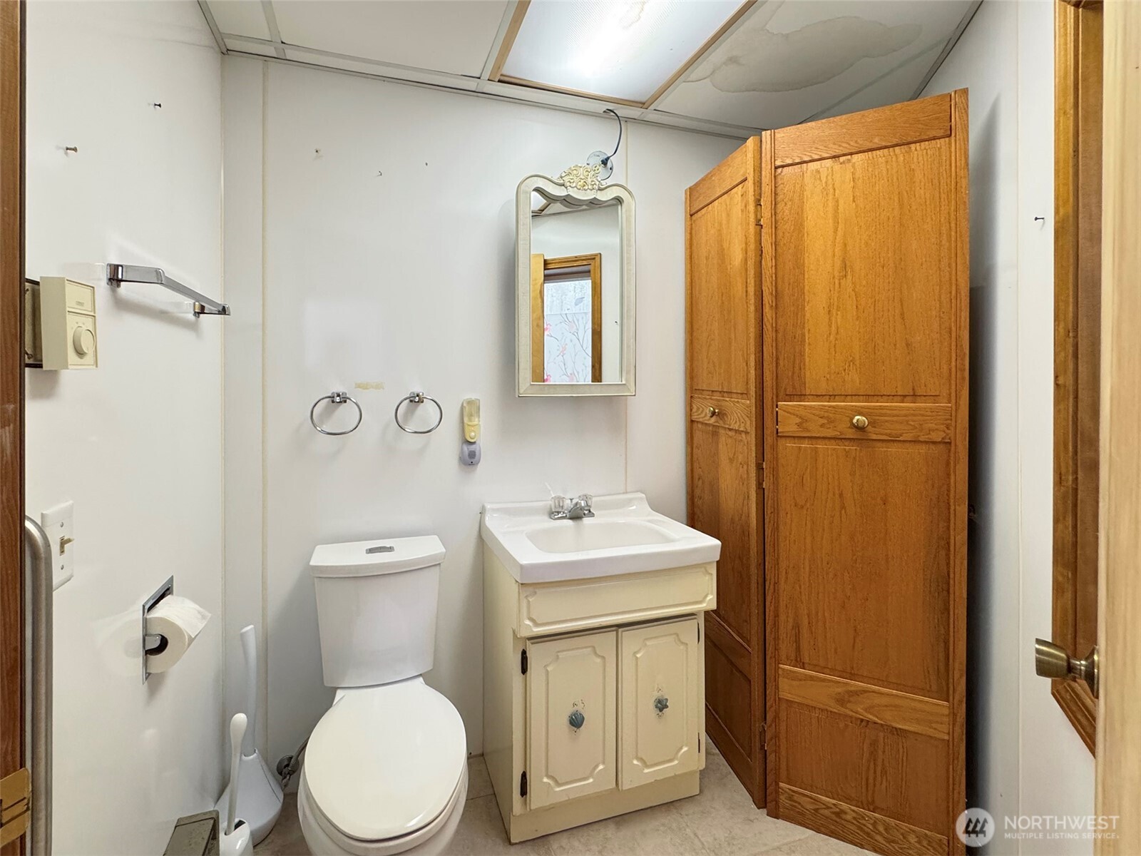 63 Hummingbird Lane Sequim, WA 98382 - Photo 34 of 40 a white toilet sitting next to a bathroom sink