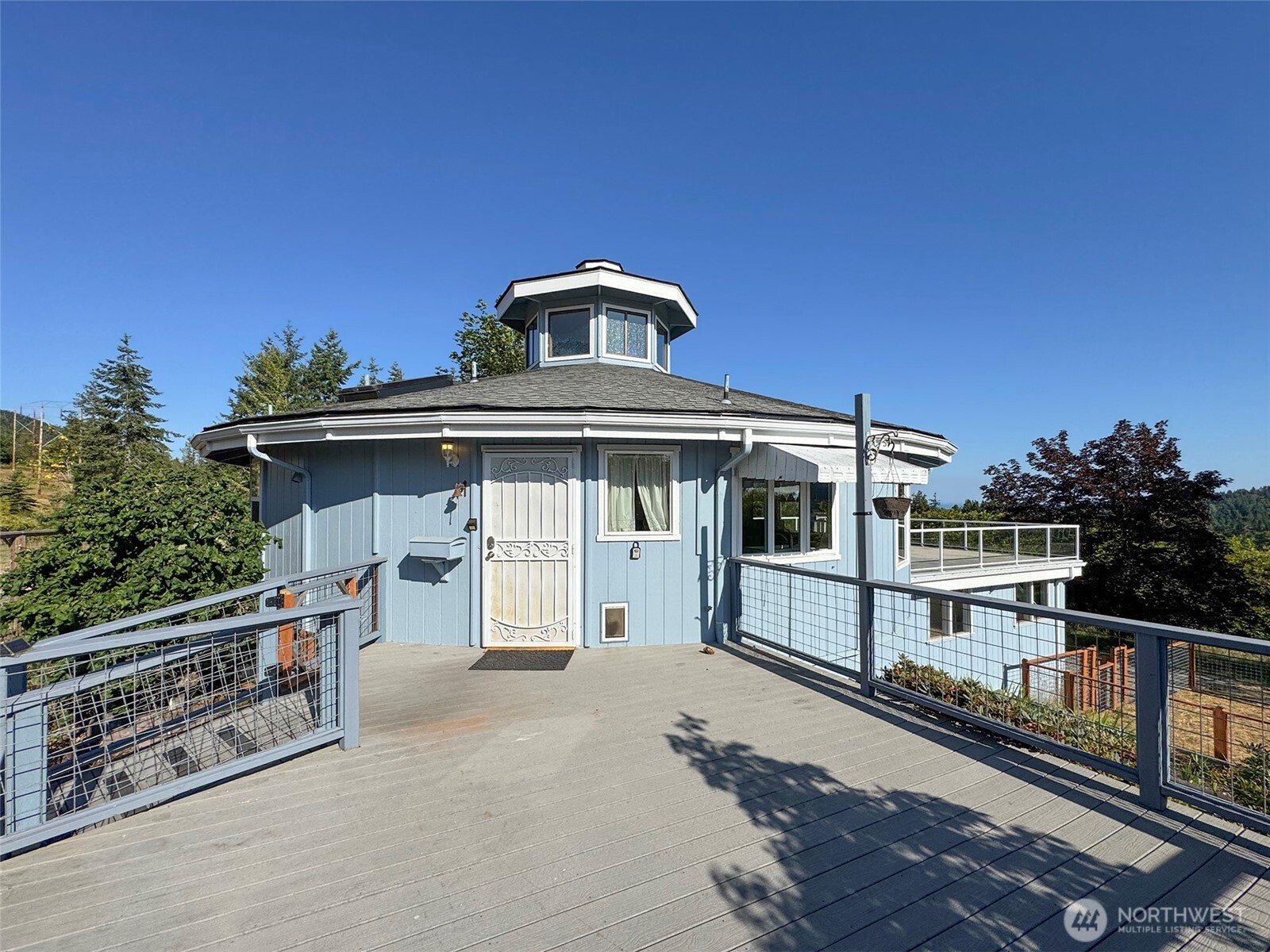 63 Hummingbird Lane Sequim, WA 98382 - Photo 37 of 40 a view of a house with a balcony