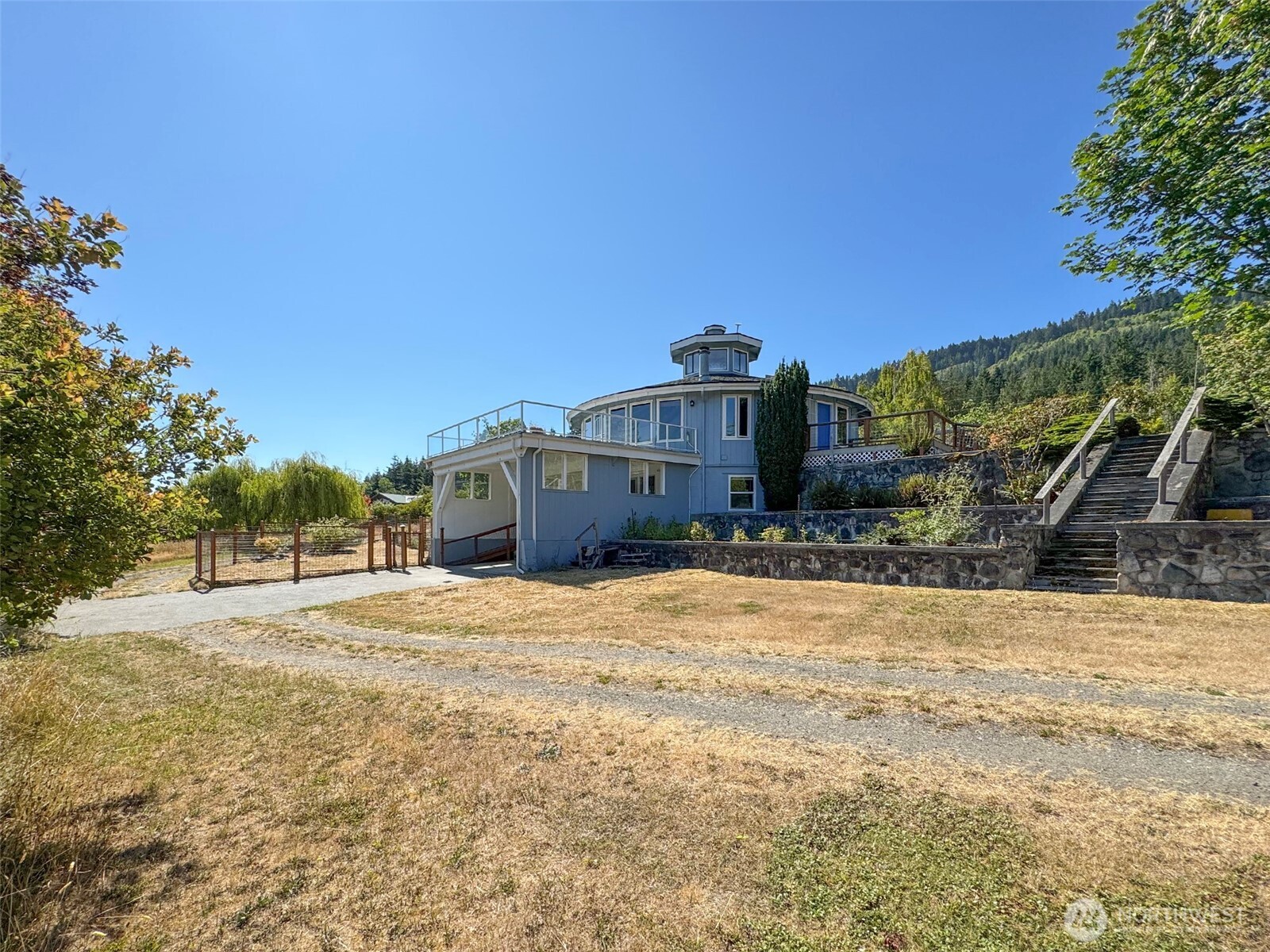 63 Hummingbird Lane Sequim, WA 98382 - Photo 5 of 40 a view of a house with a yard