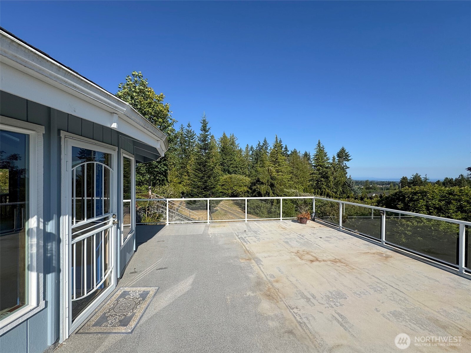 63 Hummingbird Lane Sequim, WA 98382 - Photo 10 of 40 a view of a building with a outdoor space