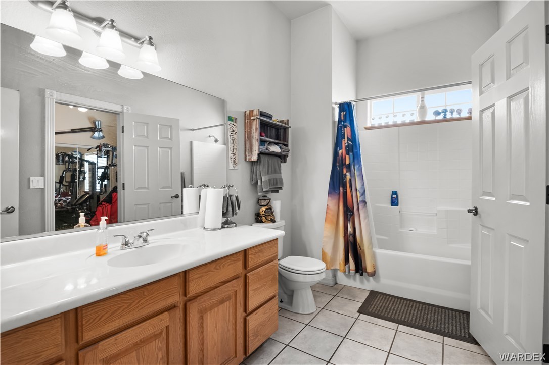 2898 Mountain Trail Road Kingman, AZ 86401 - Photo 20 of 75 a bathroom with a sink a toilet and shower