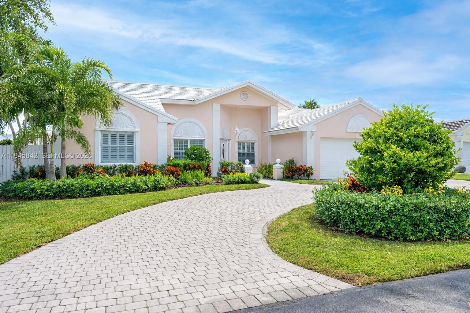11291 Southwest 62nd Terrace Miami, FL 33173 - Photo 1 of 23 a front view of a house with a garden