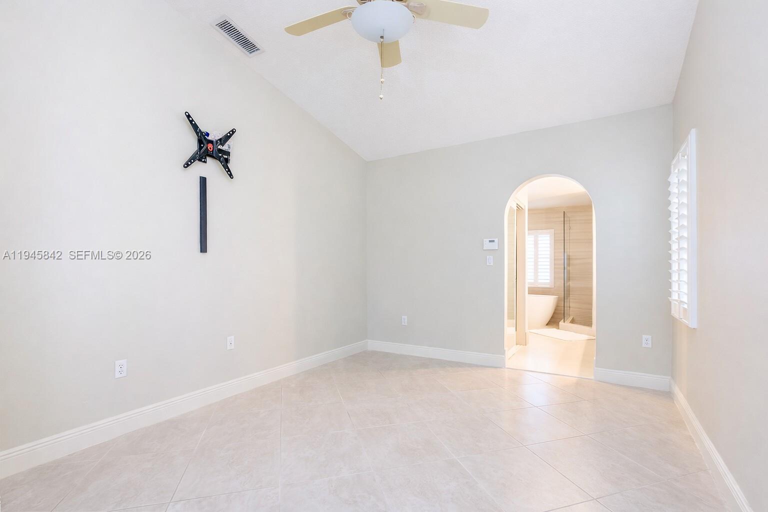 11291 Southwest 62nd Terrace Miami, FL 33173 - Photo 12 of 23 a view of an empty room with a window