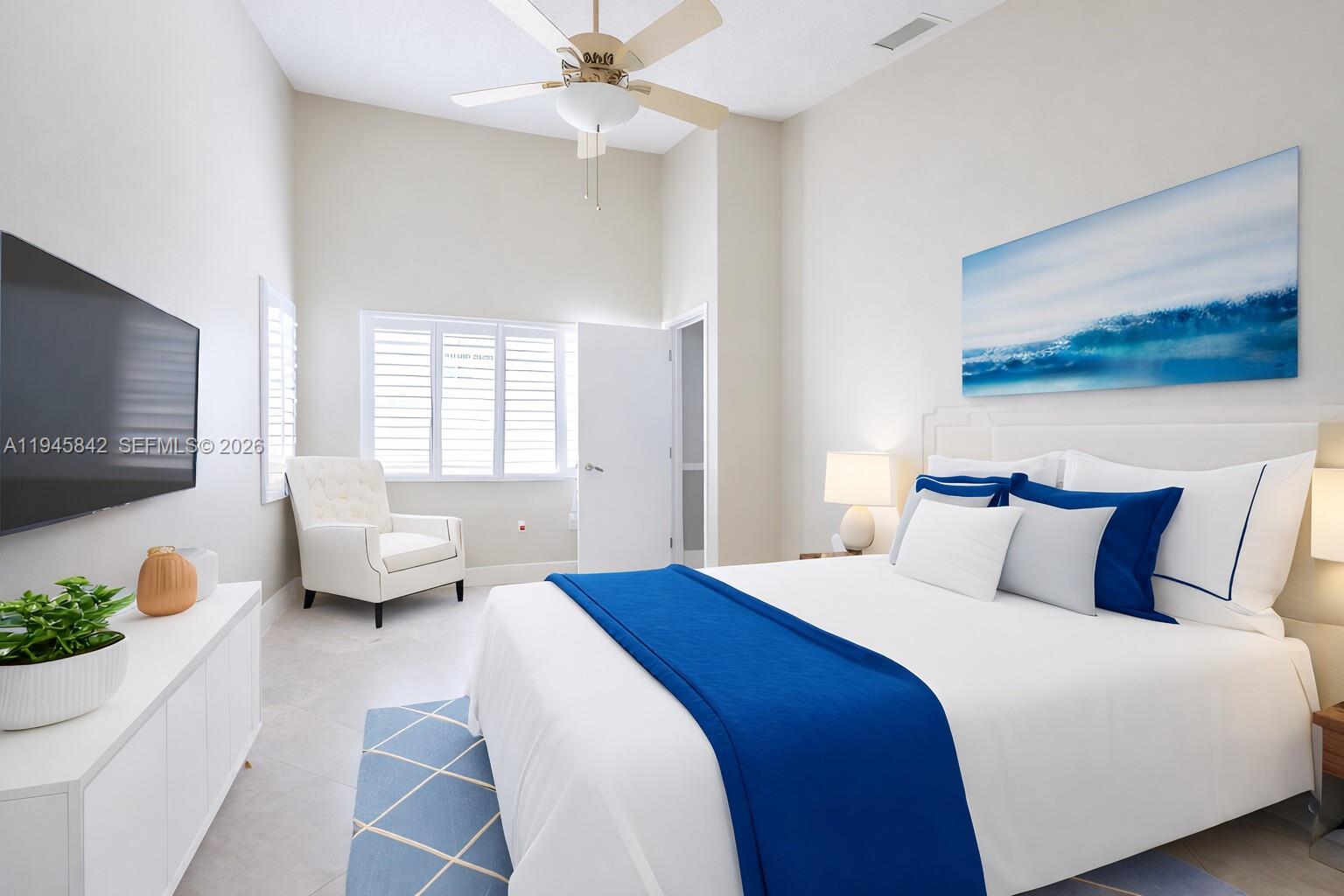 11291 Southwest 62nd Terrace Miami, FL 33173 - Photo 14 of 23 a bedroom with a bed and flat screen tv