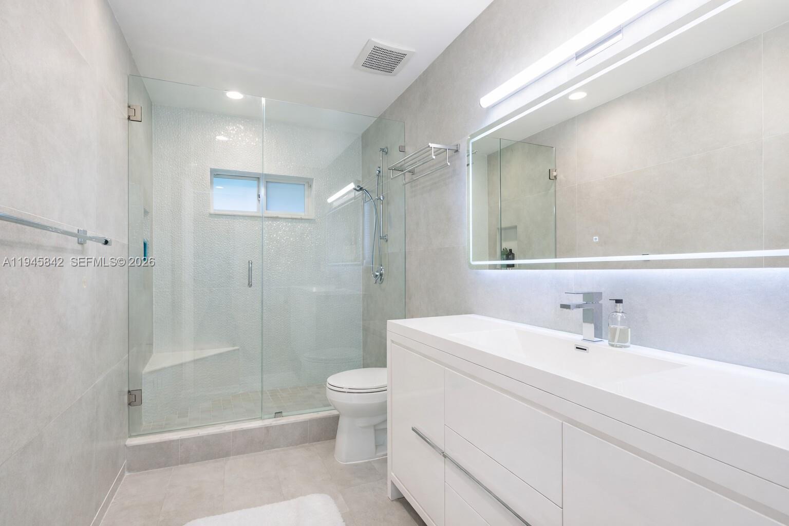 11291 Southwest 62nd Terrace Miami, FL 33173 - Photo 18 of 23 a bathroom with a sink a toilet and shower