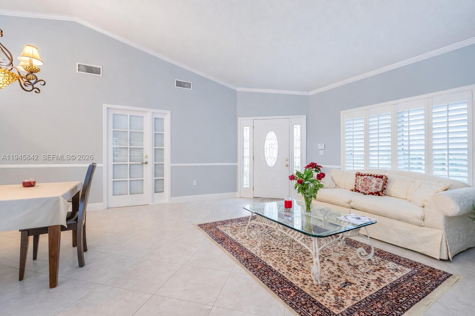11291 Southwest 62nd Terrace Miami, FL 33173 - Photo 4 of 23 a living room with furniture and a window