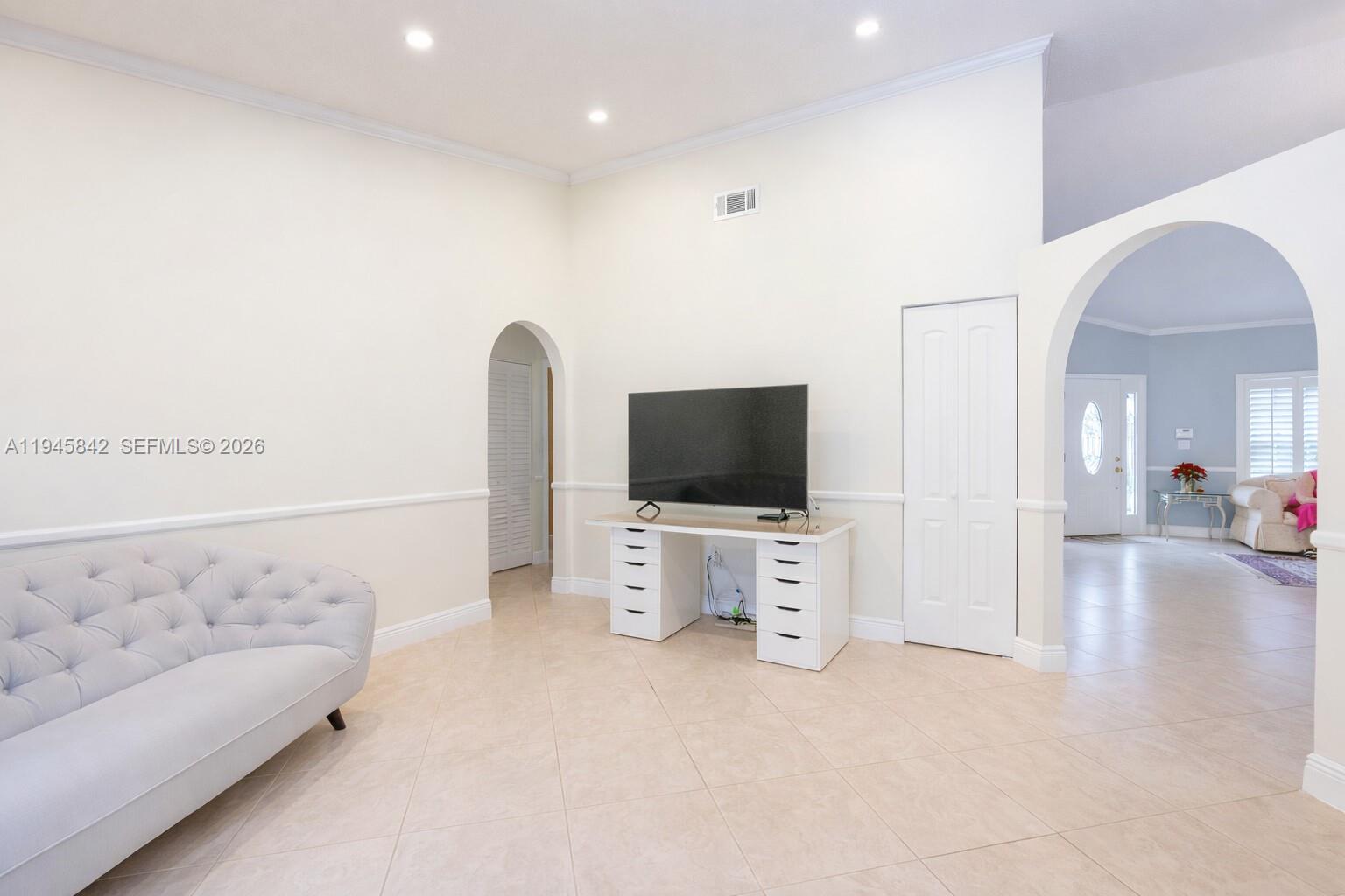 11291 Southwest 62nd Terrace Miami, FL 33173 - Photo 8 of 23 a view of a livingroom with furniture and a flat screen tv