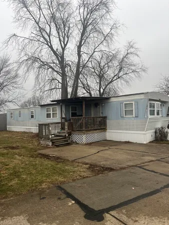 a view of a house with snow in the background