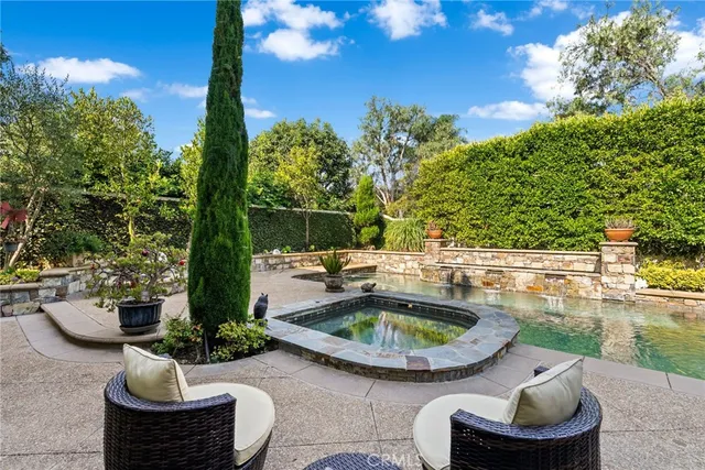 a view of a swimming pool with a patio