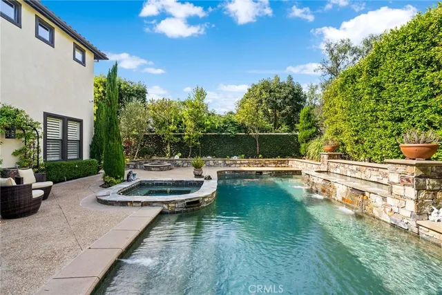 a view of a backyard with sitting area