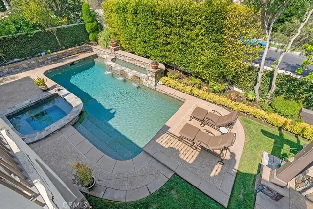 a view of a backyard with sitting area