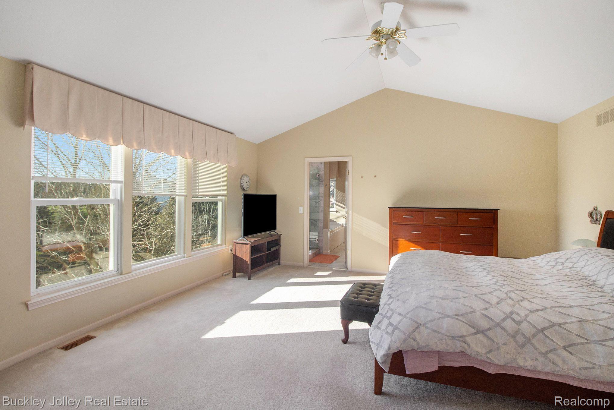 7364 Goldenrod Court Brighton, MI 48116 - Photo 6 of 23 Naturally Bright Primary with Cathedral Ceilings