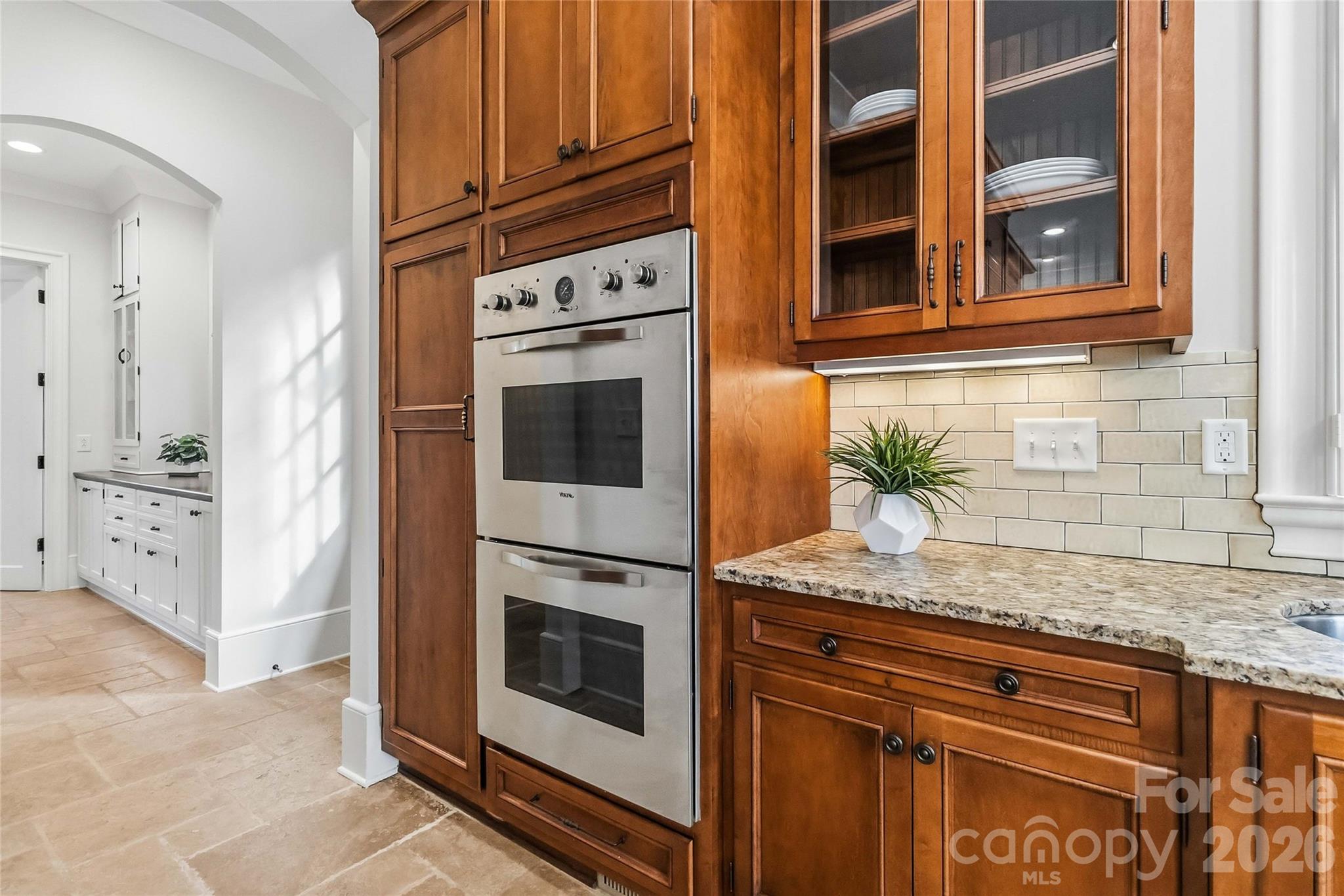 6321 Sharon Hills Road Charlotte, NC 28210 - Photo 20 of 46 a kitchen with stainless steel appliances granite countertop a stove and a microwave