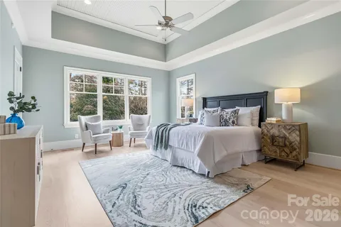 a bedroom with a large bed and a large window