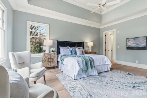 a bedroom with a large bed and a couch