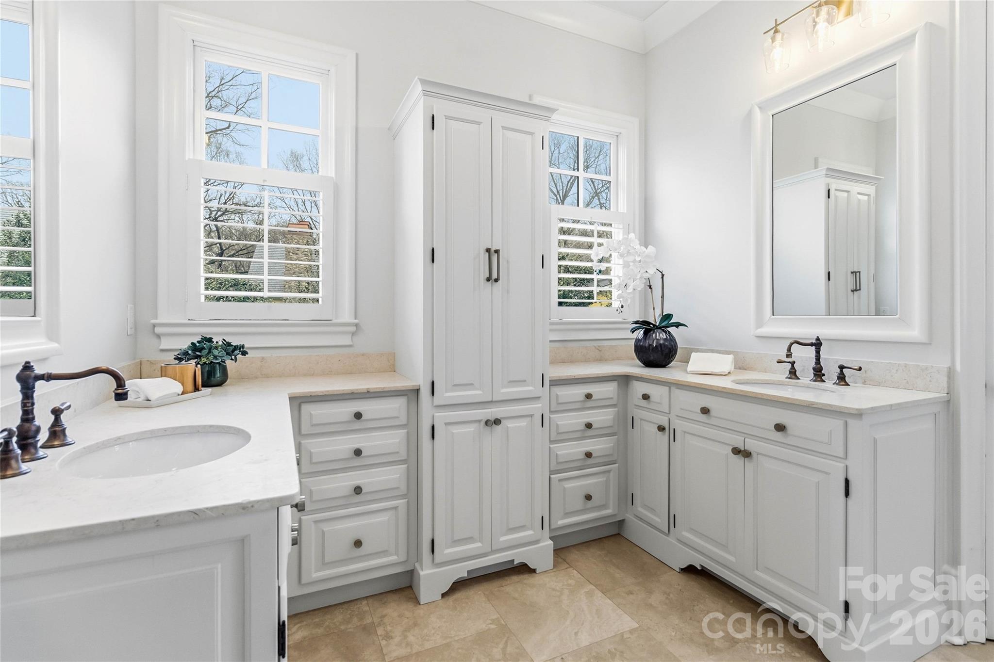6321 Sharon Hills Road Charlotte, NC 28210 - Photo 27 of 46 a spacious bathroom with double vanity sink a mirror and a bathtub