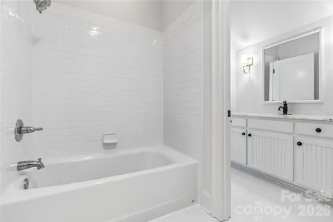 a white bath tub sitting in a bathroom