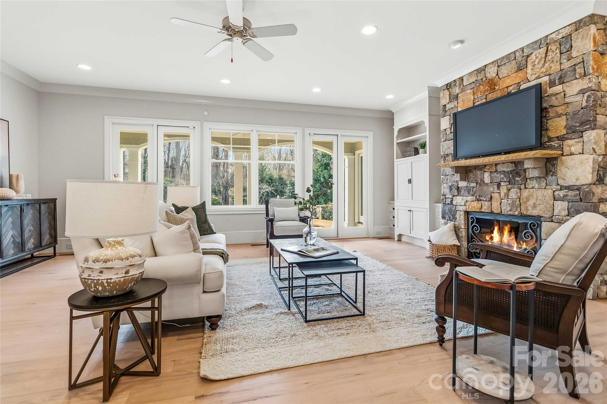 6321 Sharon Hills Road Charlotte, NC 28210 - Photo 9 of 46 a living room with fireplace furniture and a flat screen tv