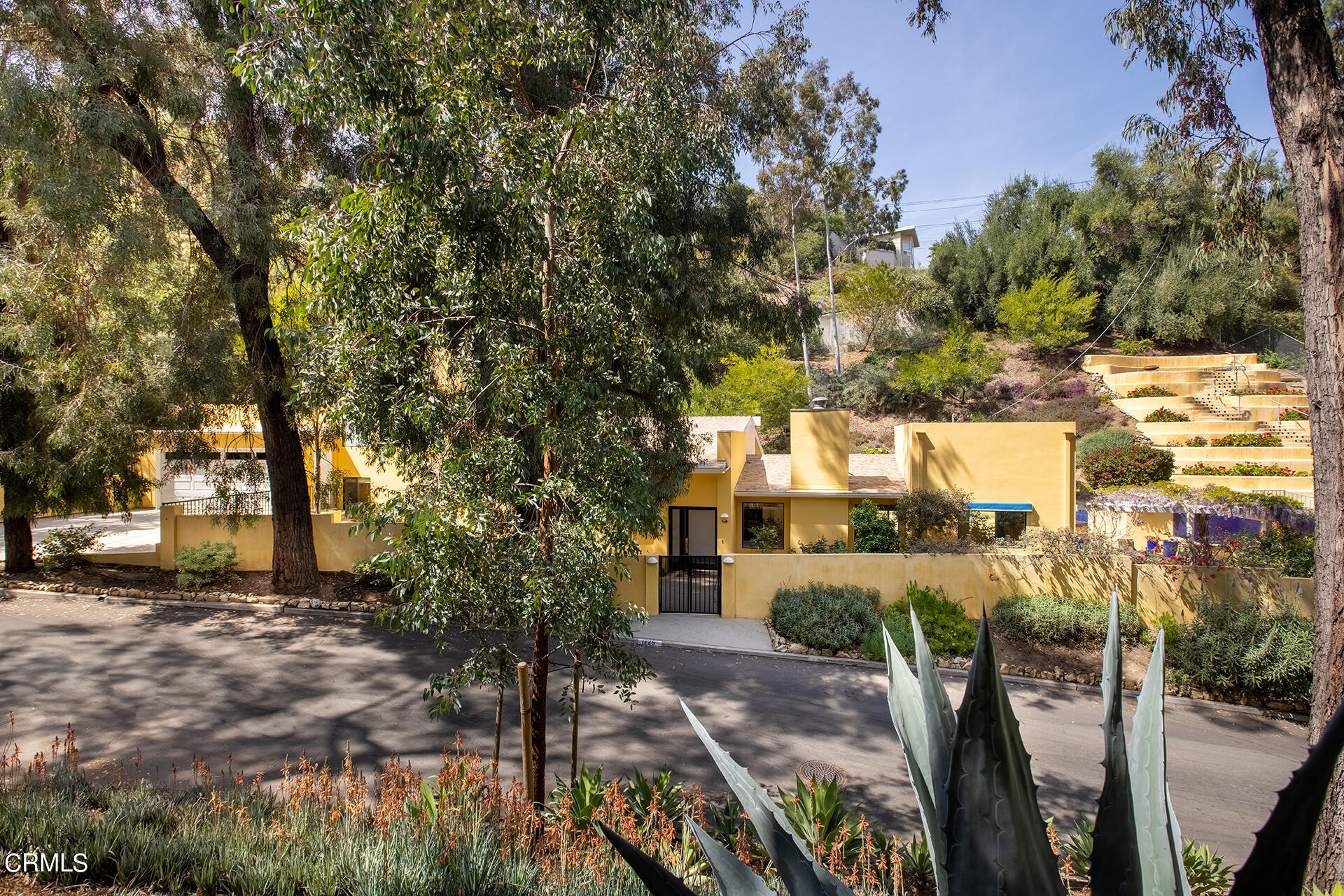 a view of a patio with table and chairs and potted plants