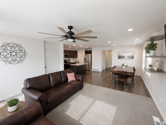 1687 South Windemere Road Santaquin, UT 84655 - Photo 9 of 27 Bright living area featuring a ceiling fan with integrated lighting, recessed lighting, and wall-to-wall carpeting